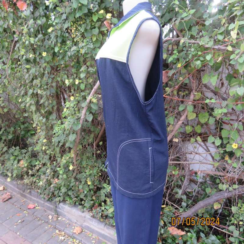 Navy nylon sleeveless zip-up nylon top with lime green front polycotton yoke.Size 42 by ML Classics
