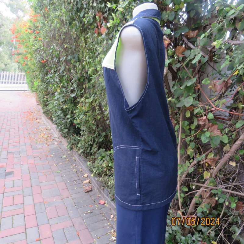 Navy nylon sleeveless zip-up nylon top with lime green front polycotton yoke.Size 42 by ML Classics