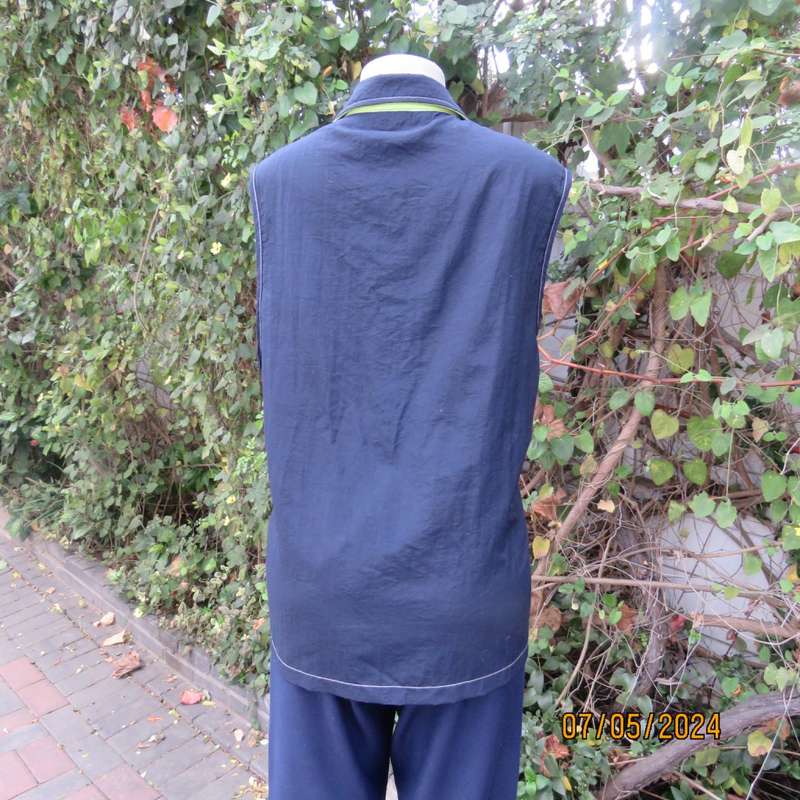 Navy nylon sleeveless zip-up nylon top with lime green front polycotton yoke.Size 42 by ML Classics