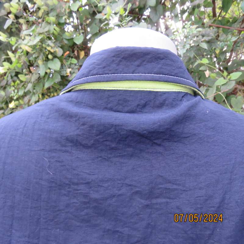 Navy nylon sleeveless zip-up nylon top with lime green front polycotton yoke.Size 42 by ML Classics