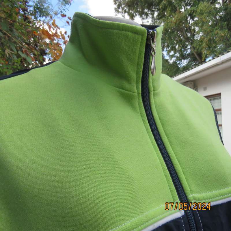 Navy nylon sleeveless zip-up nylon top with lime green front polycotton yoke.Size 42 by ML Classics