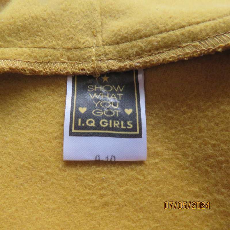Mustard colour fold over warm jacket for 9 to 10 yr old girl. By IQ. Two pockets. Band around waist.