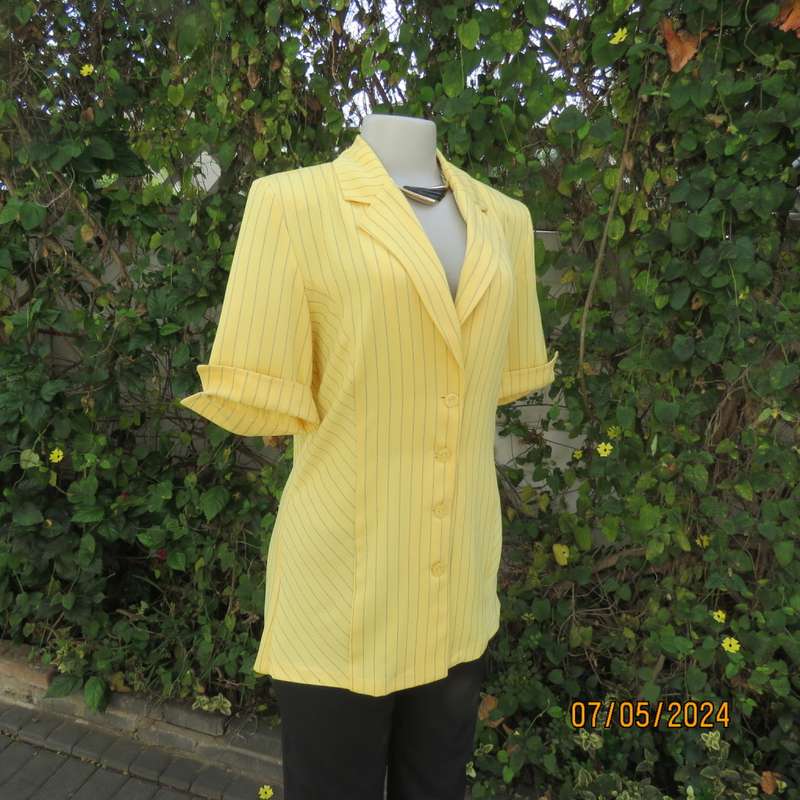 Elegant light yellow jacket with thin black stripes by ML Classics size 34/10. 4 button close.As new