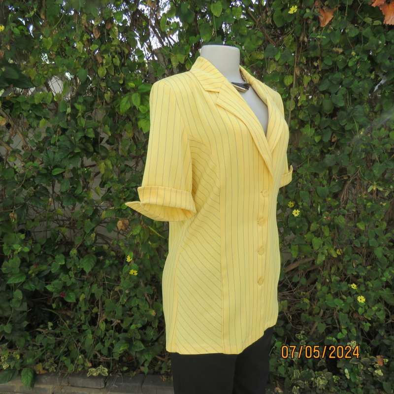 Elegant light yellow jacket with thin black stripes by ML Classics size 34/10. 4 button close.As new