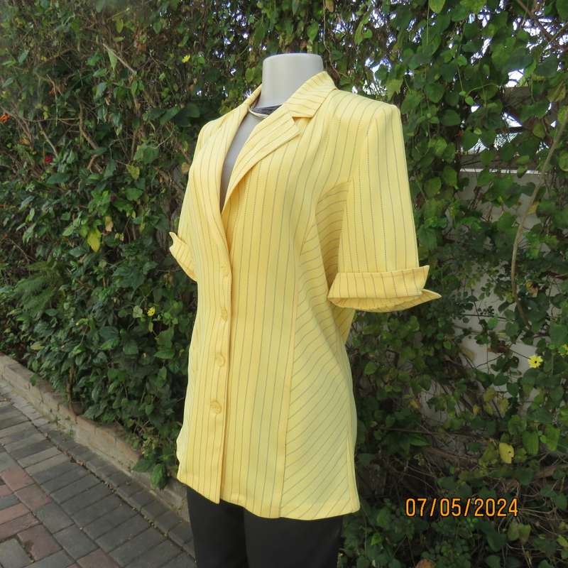 Elegant light yellow jacket with thin black stripes by ML Classics size 34/10. 4 button close.As new