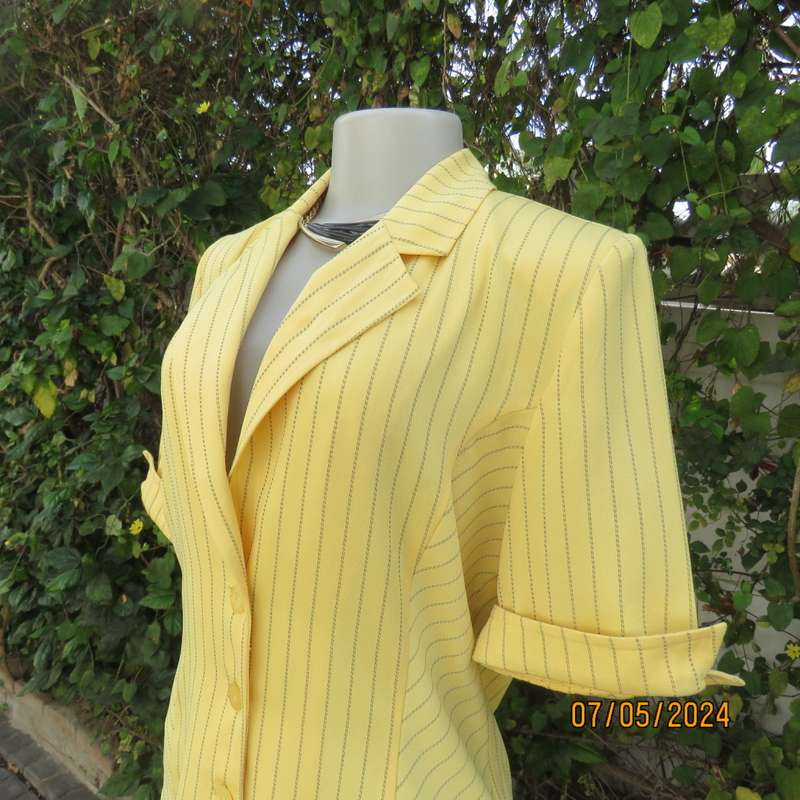 Elegant light yellow jacket with thin black stripes by ML Classics size 34/10. 4 button close.As new