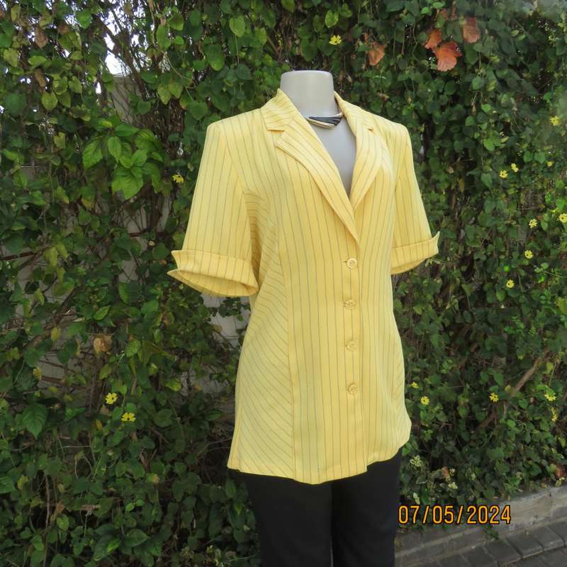 Elegant light yellow jacket with thin black stripes by ML Classics size 34/10. 4 button close.As new