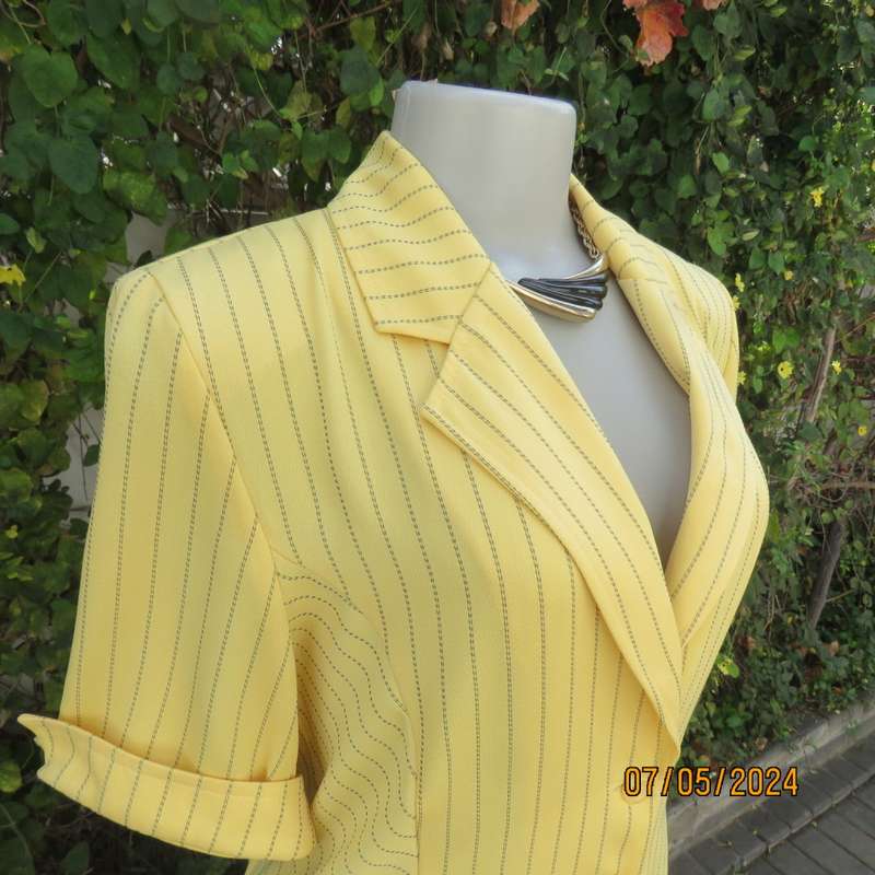 Elegant light yellow jacket with thin black stripes by ML Classics size 34/10. 4 button close.As new
