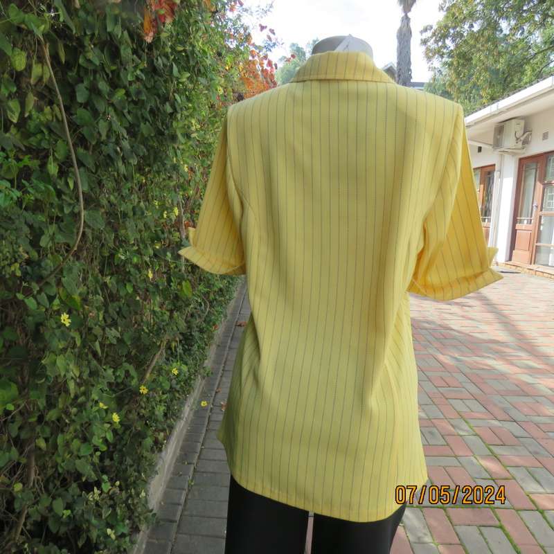 Elegant light yellow jacket with thin black stripes by ML Classics size 34/10. 4 button close.As new
