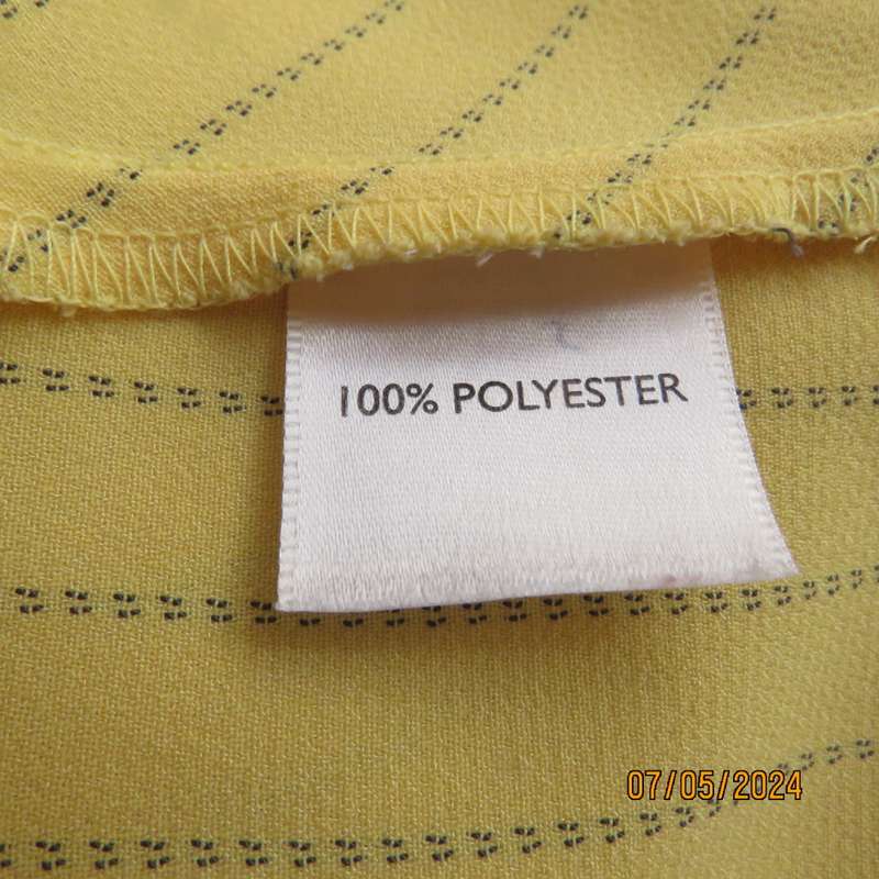 Elegant light yellow jacket with thin black stripes by ML Classics size 34/10. 4 button close.As new