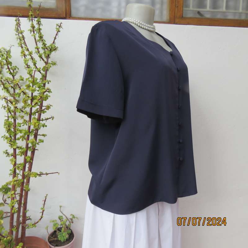 Smart, as new collarless navy silky polyester short sleeve top. Size 40.Close with loops and buttons