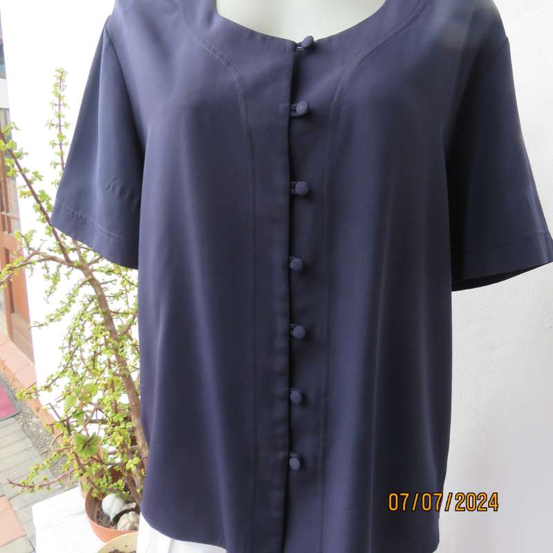 Smart, as new collarless navy silky polyester short sleeve top. Size 40.Close with loops and buttons