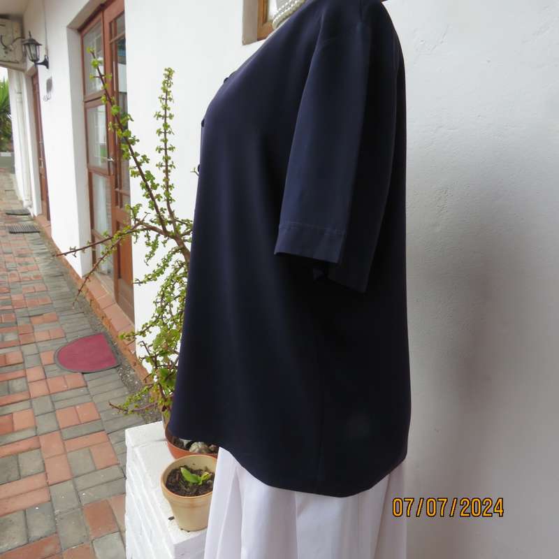 Smart, as new collarless navy silky polyester short sleeve top. Size 40.Close with loops and buttons