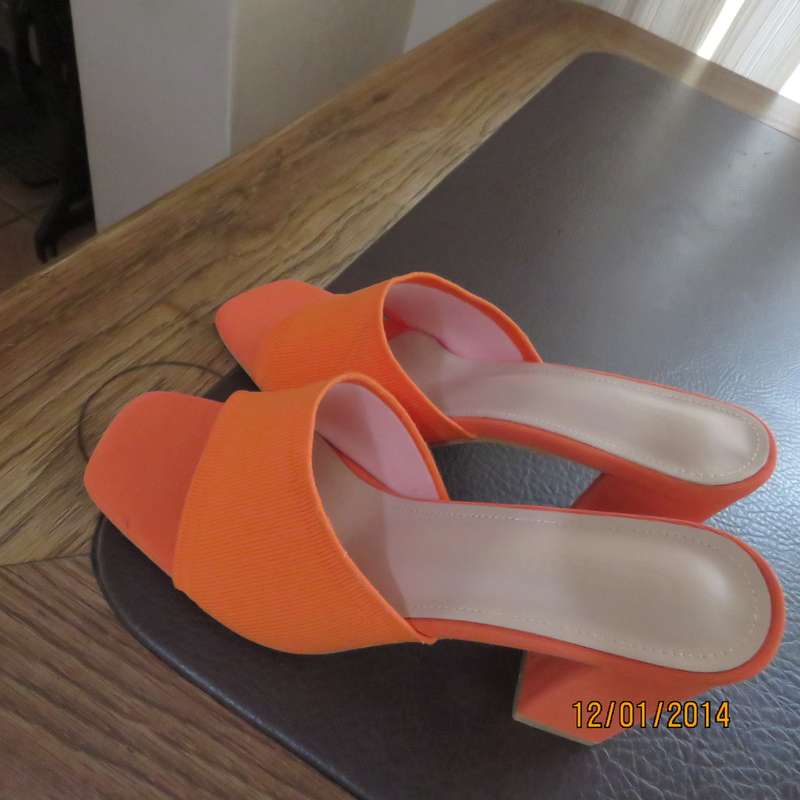 Stunning high quality papaya colour heel sandals by CUCCOO size 7. Brand new. Never worn.Wrong size.