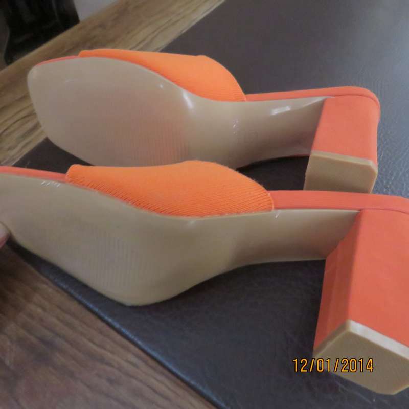 Stunning high quality papaya colour heel sandals by CUCCOO size 7. Brand new. Never worn.Wrong size.