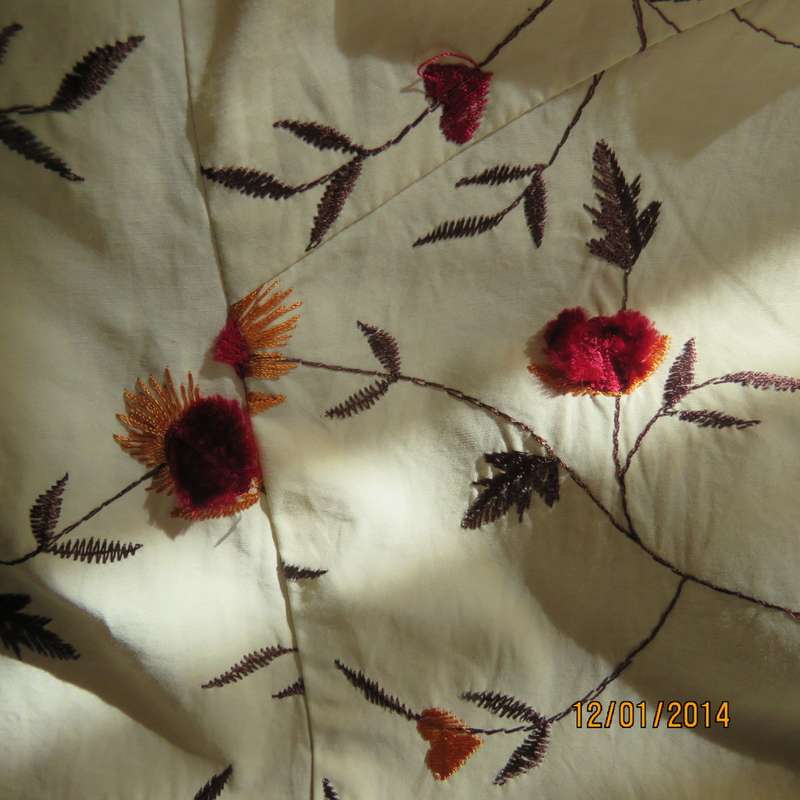 Absolute amazing short poly/nylon lined button down cream jacket. Richly embroidered. Size 33 KUHO.