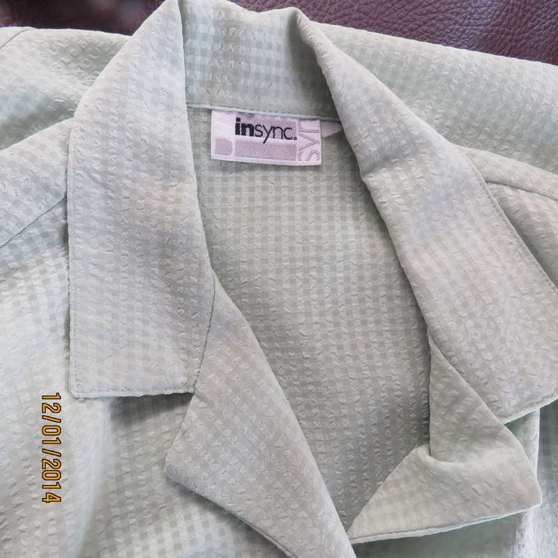 Apple green opaque small bubble check polyester button down top. Open collar. Size 36.Brand new cond