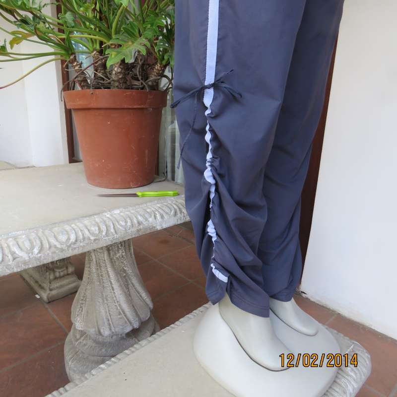 FUSION high quality grey polyester fitness pants. Blue bands at leg sides and front. Size 36.As new.