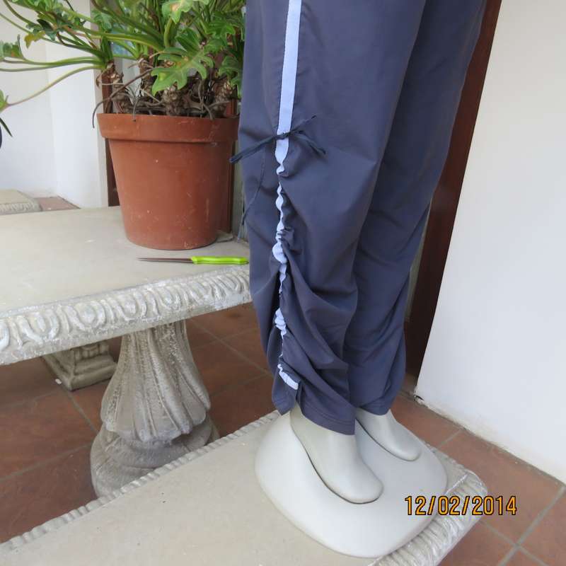 FUSION high quality grey polyester fitness pants. Blue bands at leg sides and front. Size 36.As new.