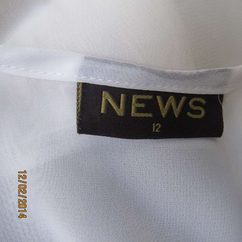 Sheer polyester slip over white sleeveless top with black horizontal stripe. By NEWS size 36. As new