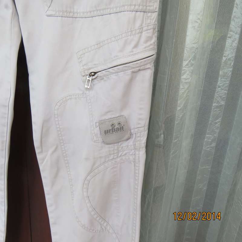 Fashion beige 100% cotton URBAN - Hilton Wiener pants. Size 34.With 5 pockets.Many studs. As new.