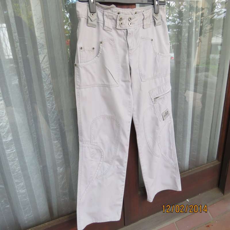 Fashion beige 100% cotton URBAN - Hilton Wiener pants. Size 34.With 5 pockets.Many studs. As new.