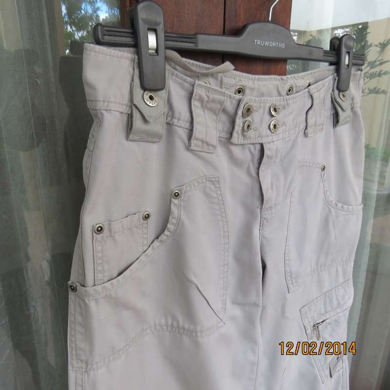 Fashion beige 100% cotton URBAN - Hilton Wiener pants. Size 34.With 5 pockets.Many studs. As new.