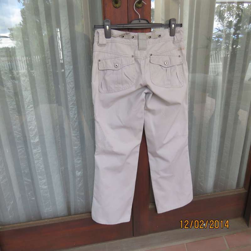Fashion beige 100% cotton URBAN - Hilton Wiener pants. Size 34.With 5 pockets.Many studs. As new.