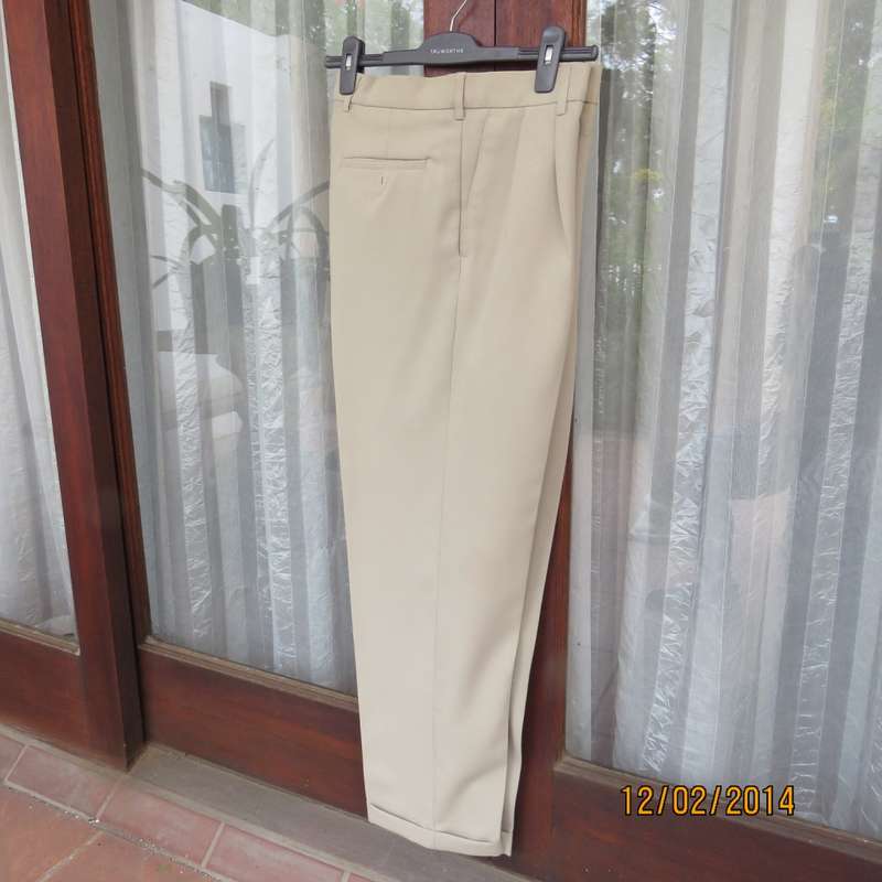 Well known MICHAEL RYAN pants size 35 in dark champagne polyester with stretch. New condition.