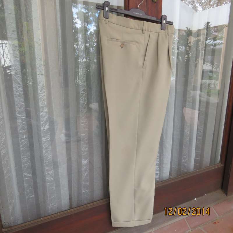 Well known MICHAEL RYAN pants size 35 in dark champagne polyester with stretch. New condition.