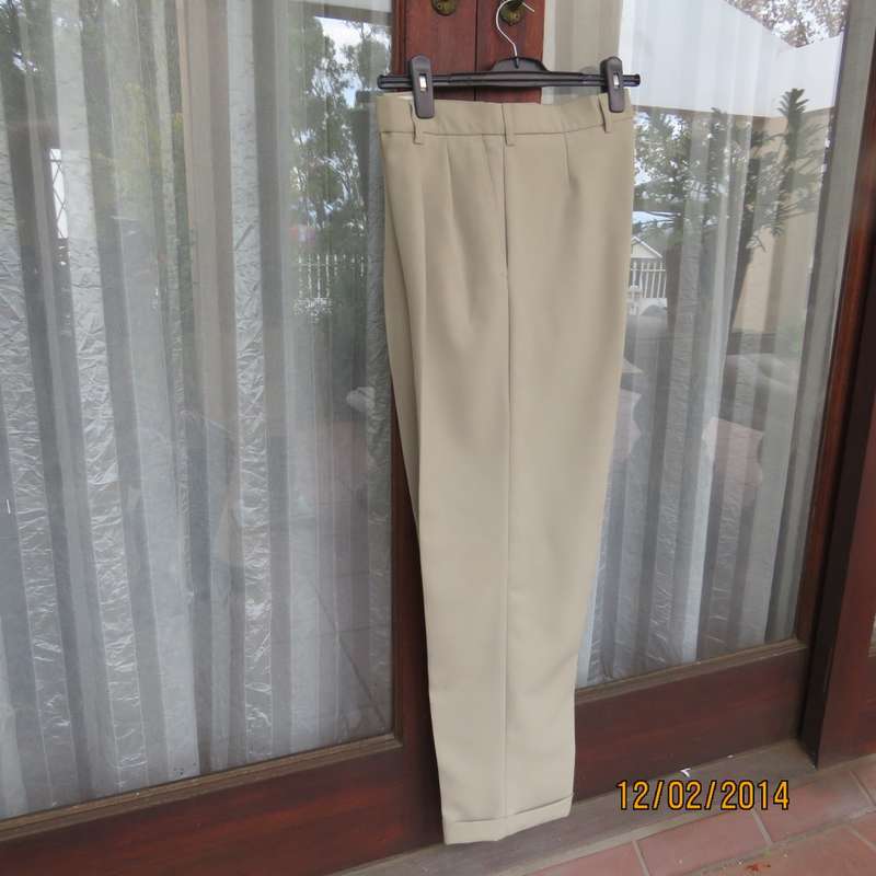 Well known MICHAEL RYAN pants size 35 in dark champagne polyester with stretch. New condition.