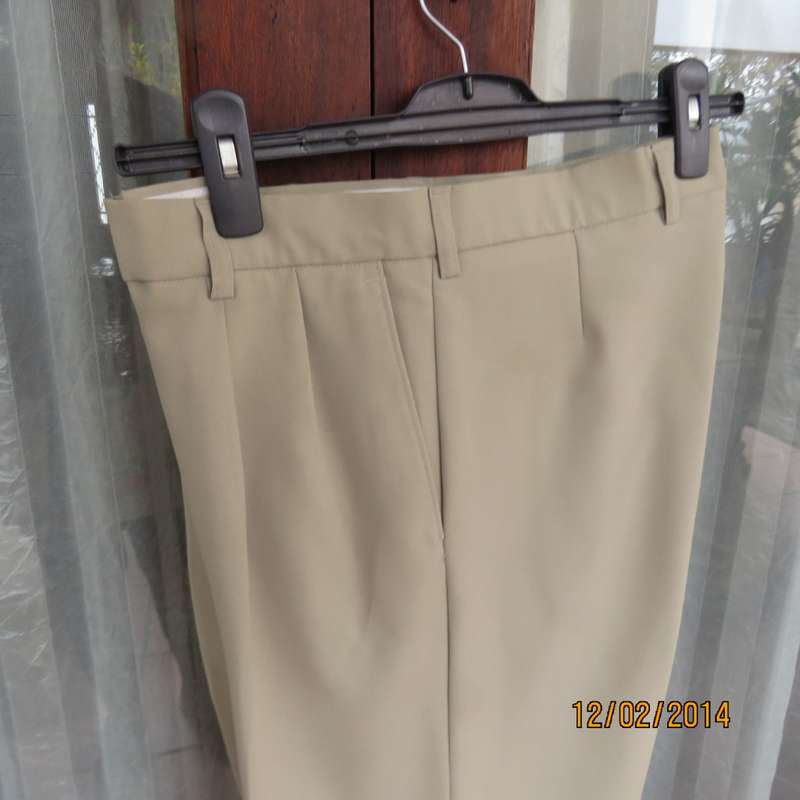 Well known MICHAEL RYAN pants size 35 in dark champagne polyester with stretch. New condition.