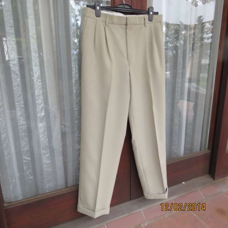 Well known MICHAEL RYAN pants size 35 in dark champagne polyester with stretch. New condition.