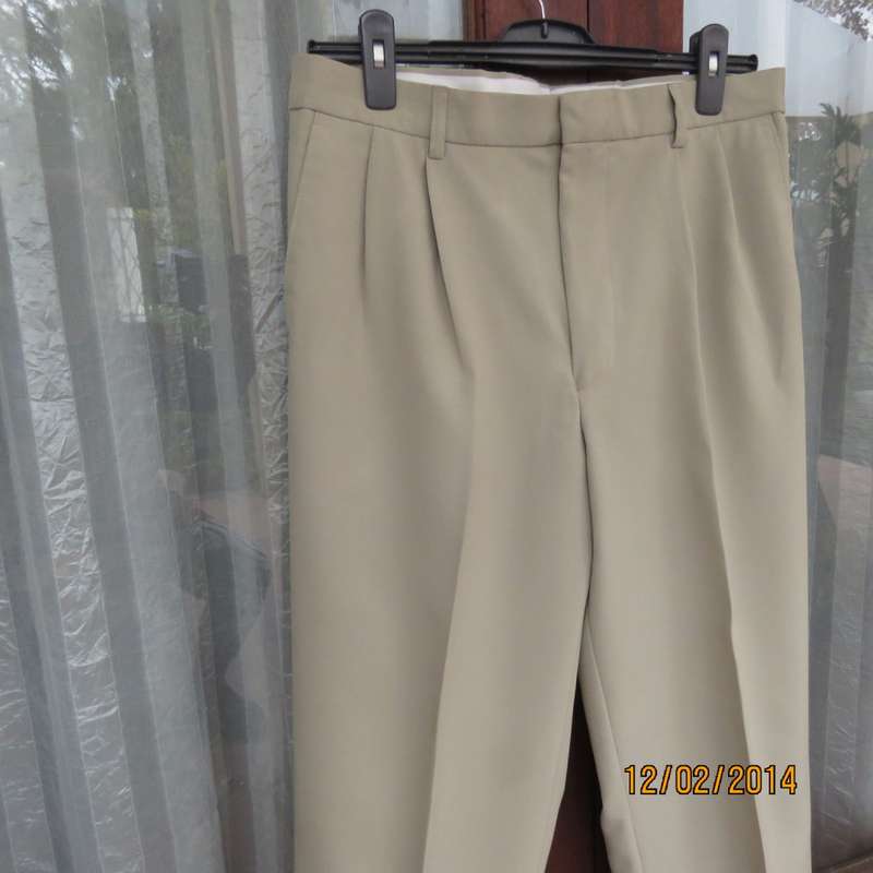 Well known MICHAEL RYAN pants size 35 in dark champagne polyester with stretch. New condition.