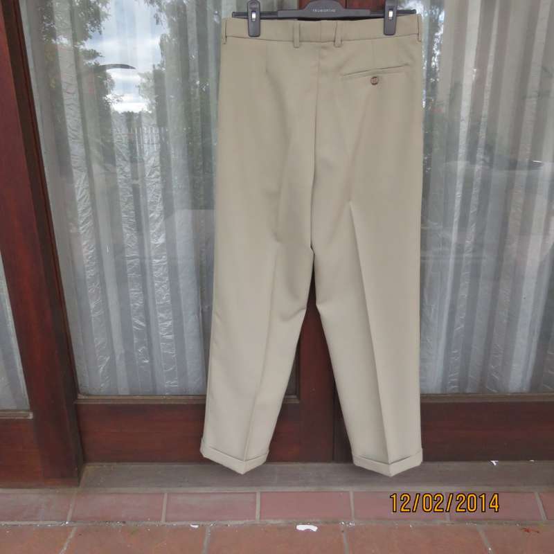 Well known MICHAEL RYAN pants size 35 in dark champagne polyester with stretch. New condition.