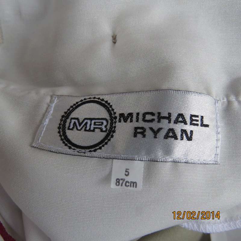 Well known MICHAEL RYAN pants size 35 in dark champagne polyester with stretch. New condition.