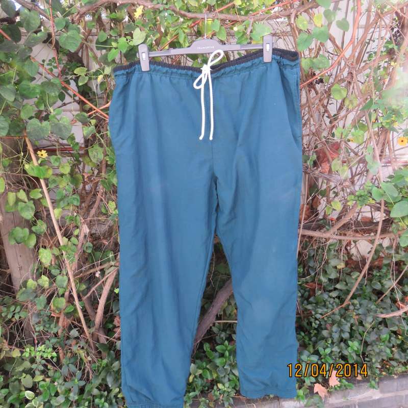 Men's dark jade tracksuit pants in nylon with polycotton stretch inner. Drawstring waist.Size XL.
