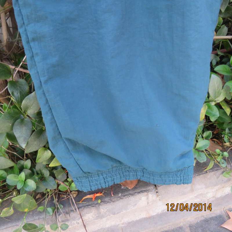 Men's dark jade tracksuit pants in nylon with polycotton stretch inner. Drawstring waist.Size XL.