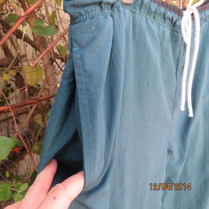Men's dark jade tracksuit pants in nylon with polycotton stretch inner. Drawstring waist.Size XL.