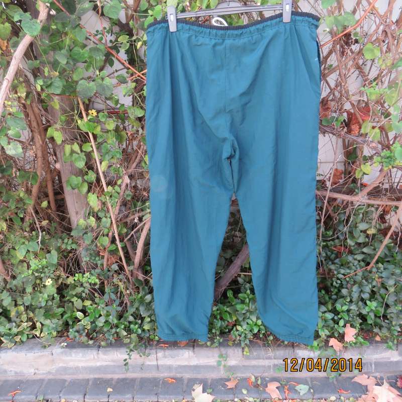 Men's dark jade tracksuit pants in nylon with polycotton stretch inner. Drawstring waist.Size XL.