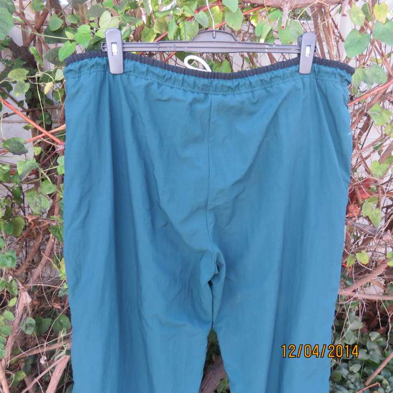 Men's dark jade tracksuit pants in nylon with polycotton stretch inner. Drawstring waist.Size XL.