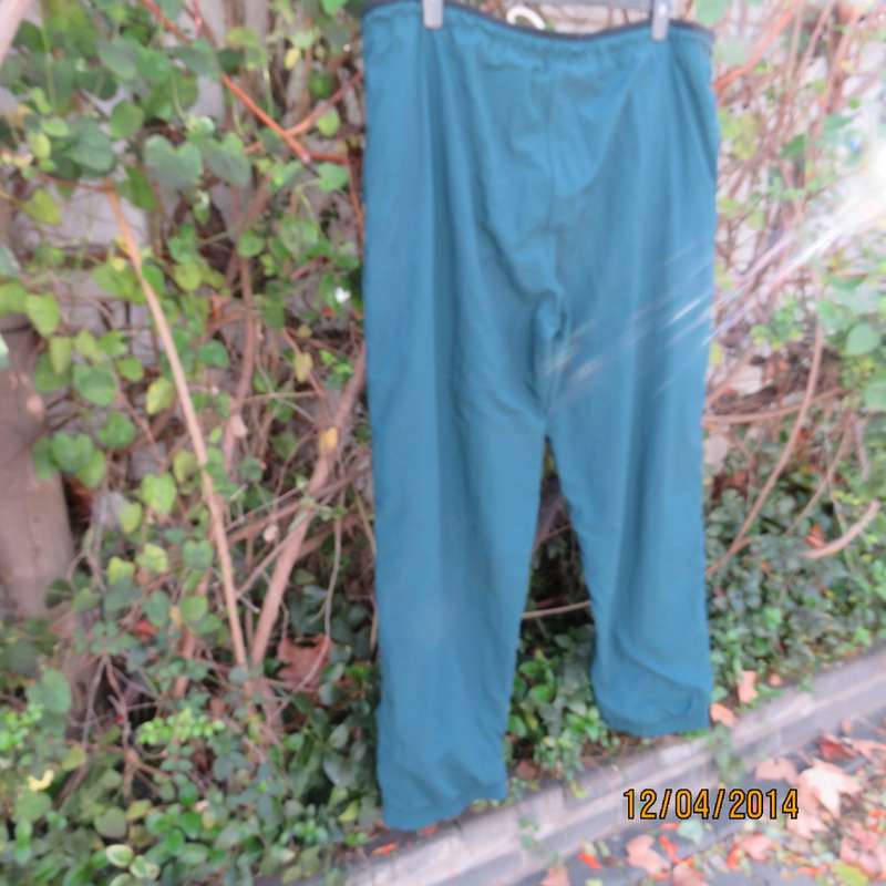 Men's dark jade tracksuit pants in nylon with polycotton stretch inner. Drawstring waist.Size XL.