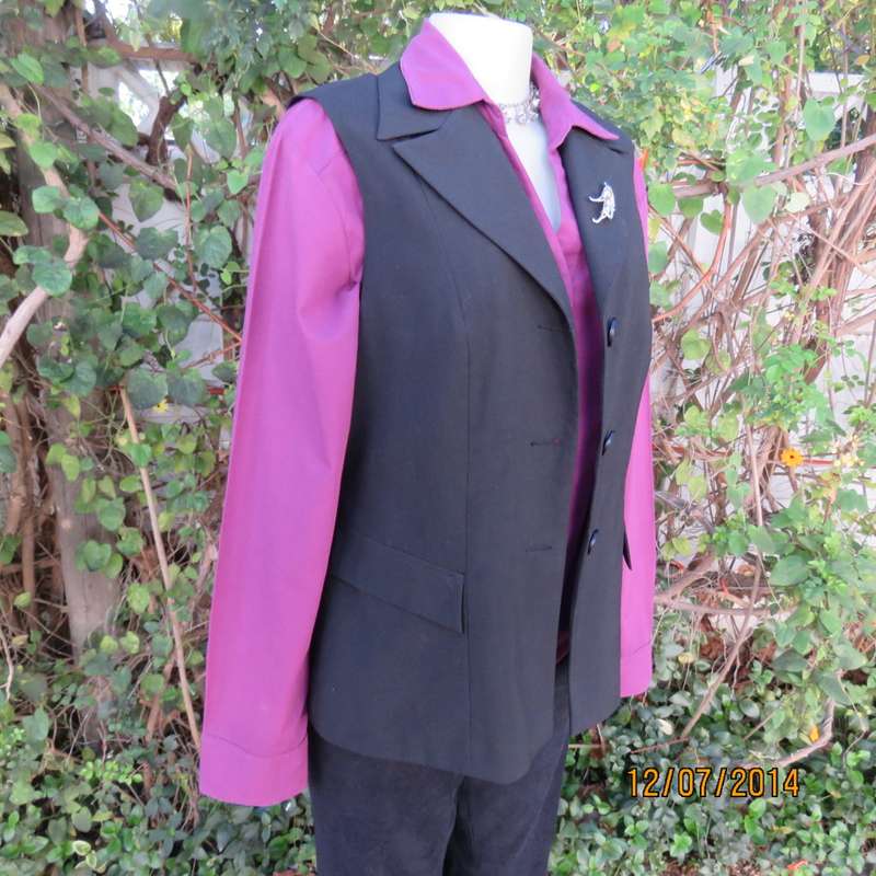 Elegant black sleeveless lined jacket.Three button closure/open collar. Size 38 by OASIS. New cond
