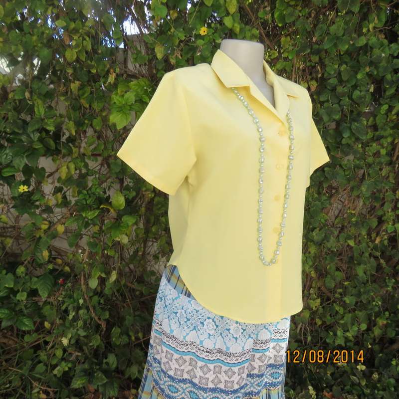 Pretty buttercup yellow short sleeve top with button down/open collar.Size 36. Brand new cond.