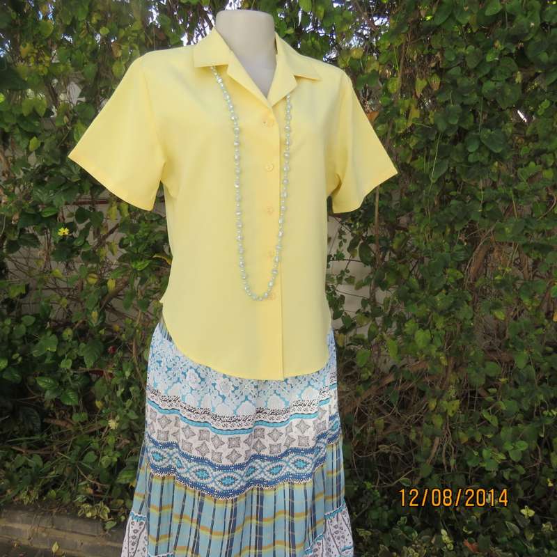 Pretty buttercup yellow short sleeve top with button down/open collar.Size 36. Brand new cond.