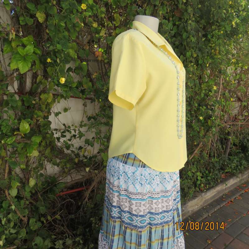 Pretty buttercup yellow short sleeve top with button down/open collar.Size 36. Brand new cond.