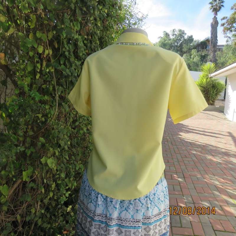 Pretty buttercup yellow short sleeve top with button down/open collar.Size 36. Brand new cond.