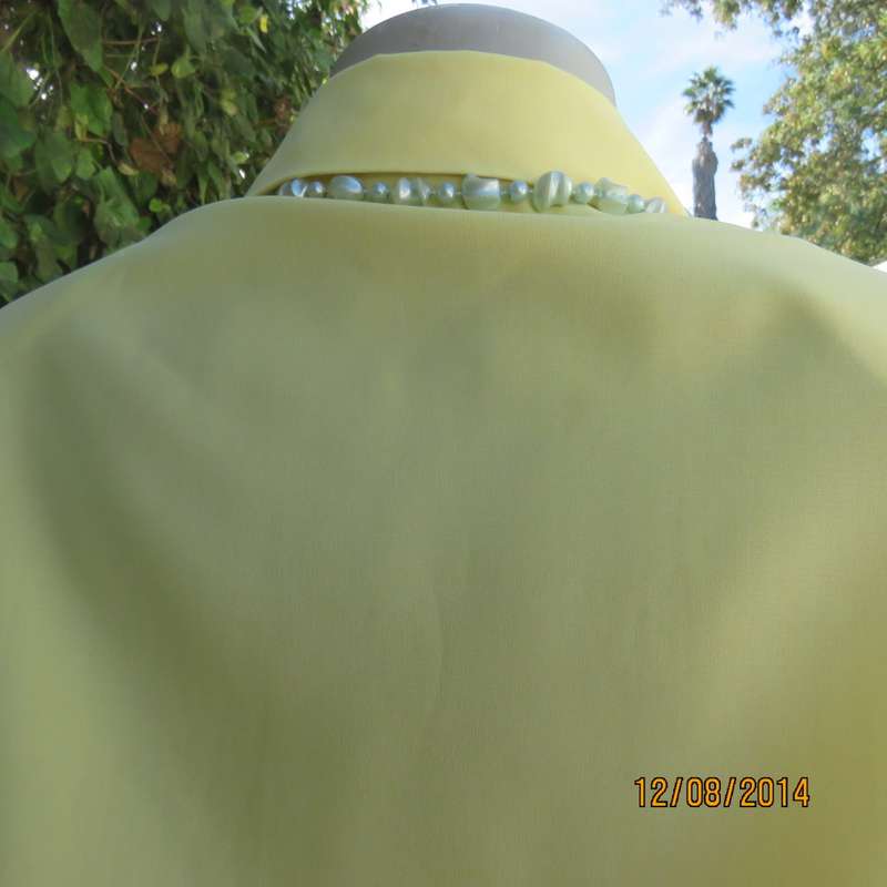 Pretty buttercup yellow short sleeve top with button down/open collar.Size 36. Brand new cond.