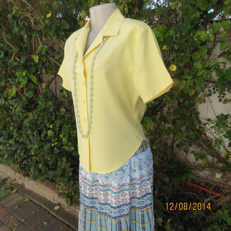 Pretty buttercup yellow short sleeve top with button down/open collar.Size 36. Brand new cond.
