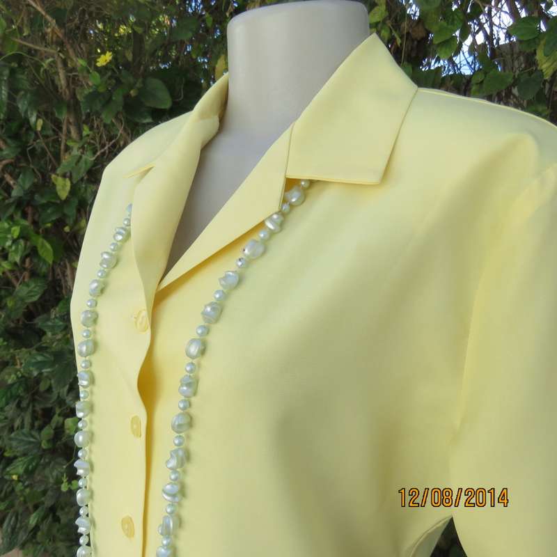 Pretty buttercup yellow short sleeve top with button down/open collar.Size 36. Brand new cond.